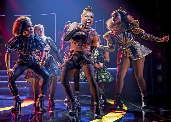This image released by Boneau/Bryan Brown shows Brittney Mack, center, during a performance of "Six."