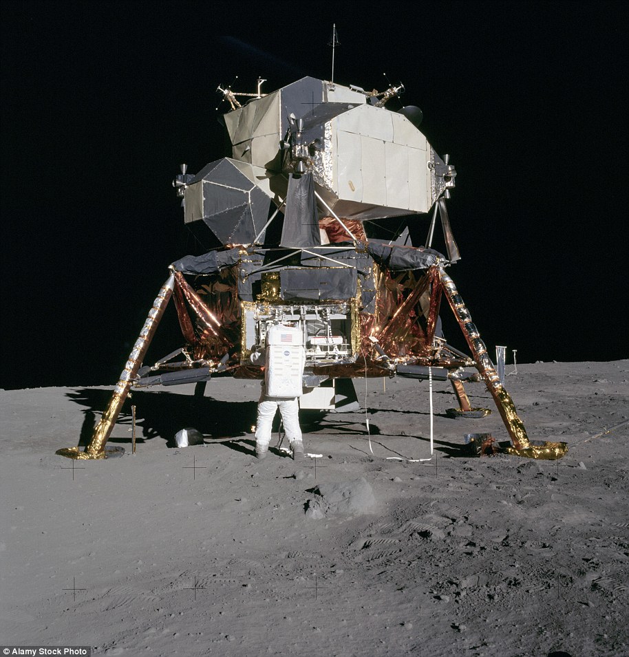 Astronaut Edwin 'Buzz' Aldrin unpack experiments from the lunar module on the moon during the Apollo 11 mission. Photographed by Neil Armstrong, July 20, 1969