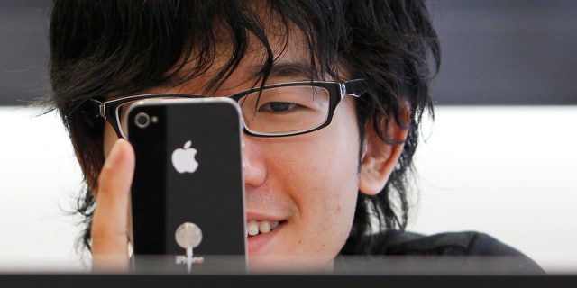 A customer tries an iPhone.